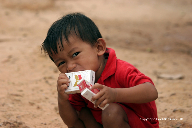 Playing, Angkor, Cambodia Playing, Angkor, Cambodia